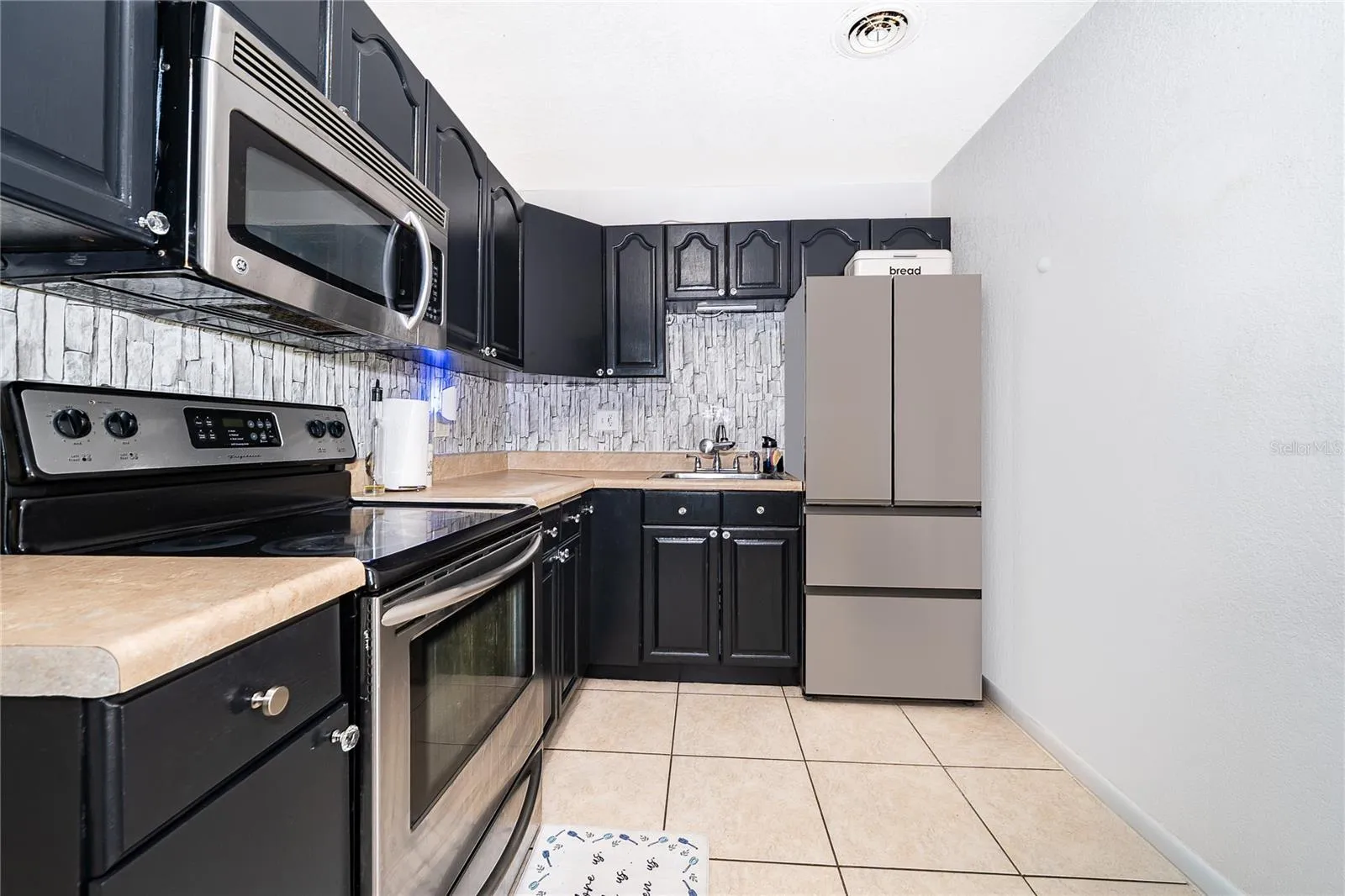 Another look at the kitchen, offering convenient storage, practical workspace, and everything you need for everyday cooking.