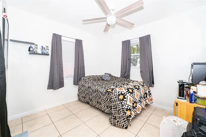 A comfortable bedroom filled with natural light, offering a relaxing space to unwind and recharge.