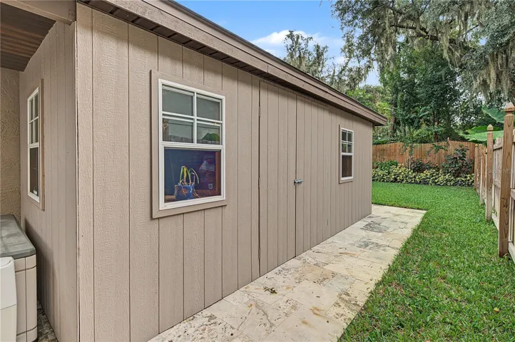 Side shed in back yard on cement slab