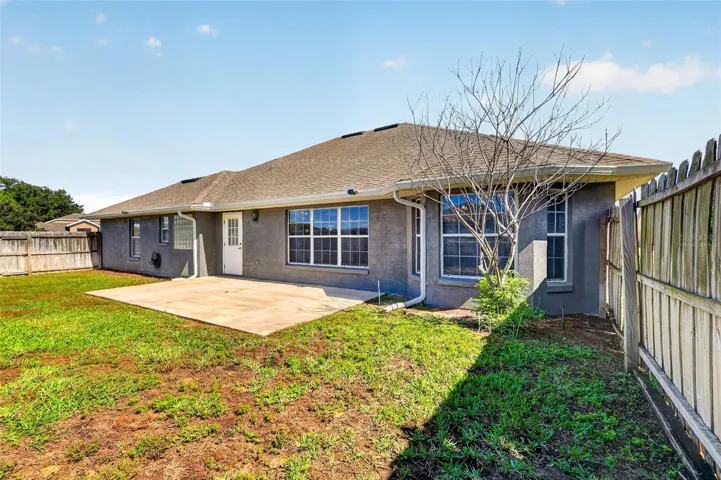*virtually staged* Patio with fenced backyard