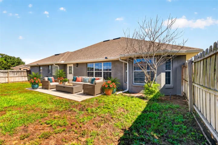 Patio with fenced backyard