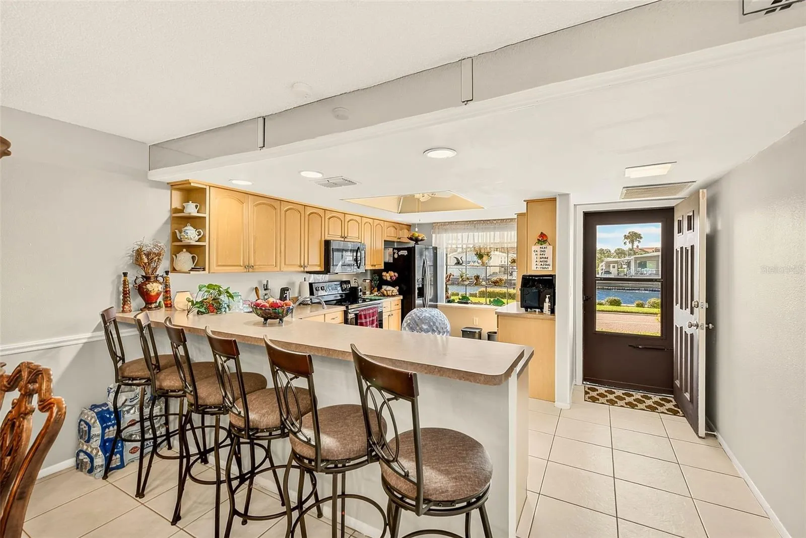 View of kitchen with bar stools