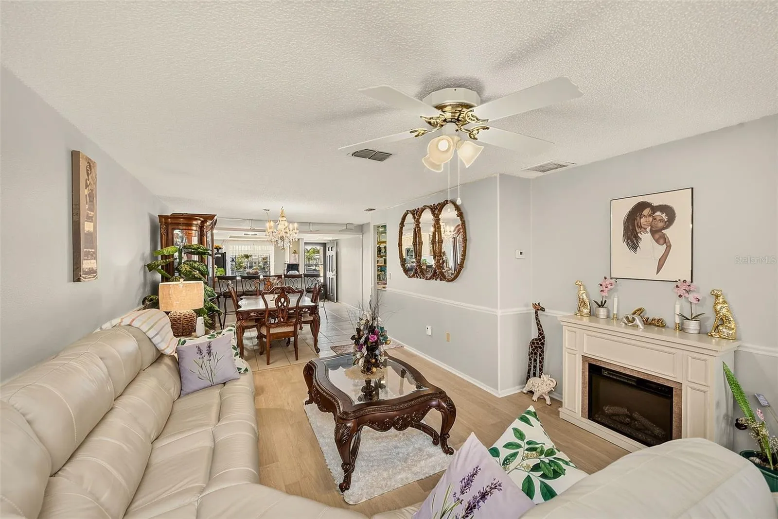 View of living room, dining room and kitchen