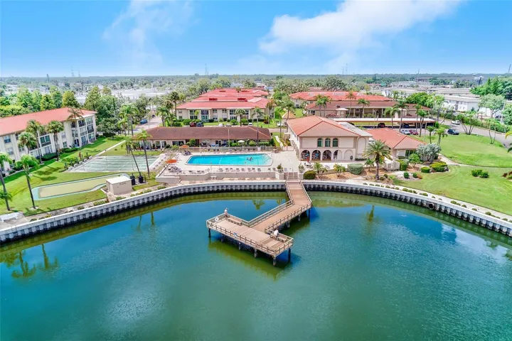 Aerial view of clubhouse, pool and fishing pier