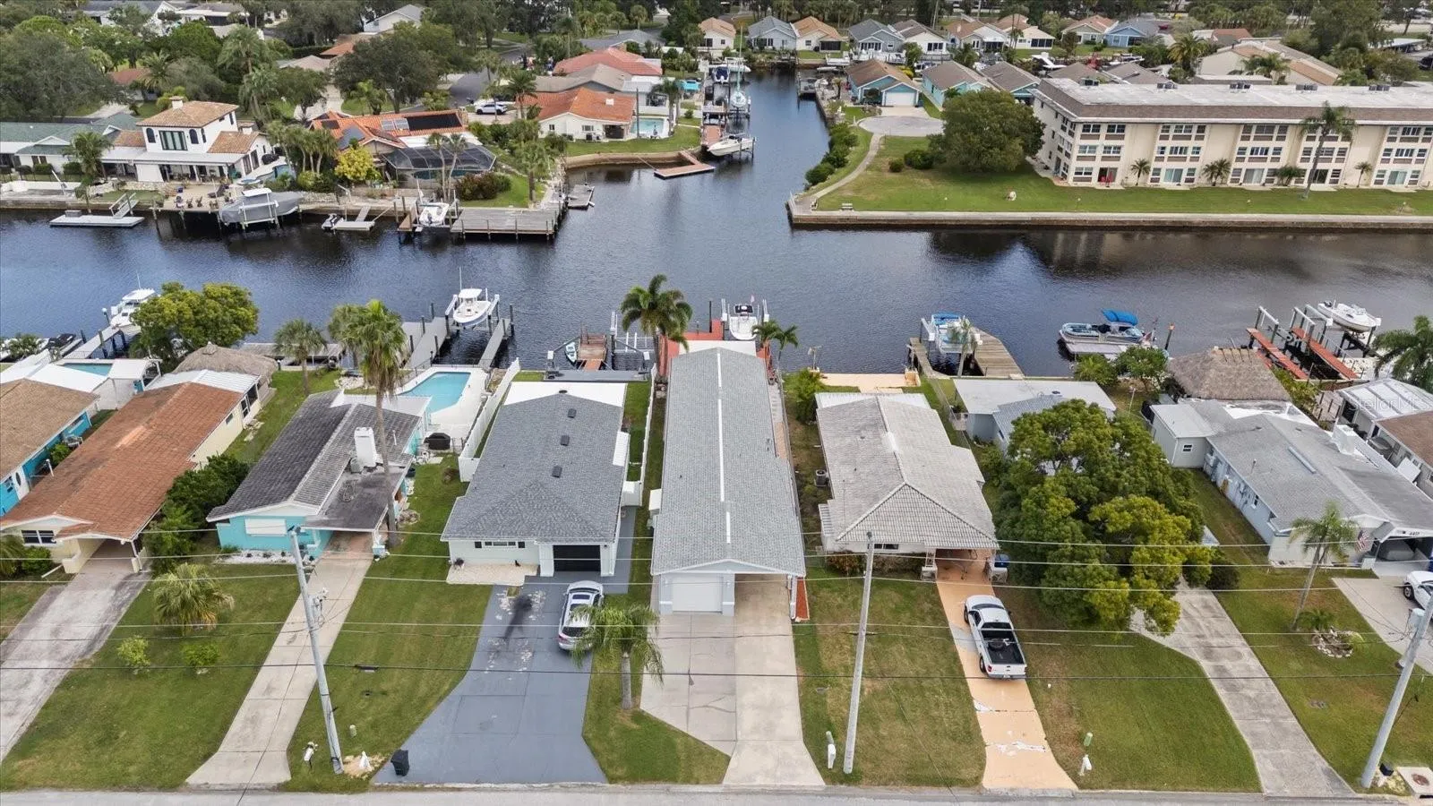 Aerial view of home with wide North channel waterviews in back.