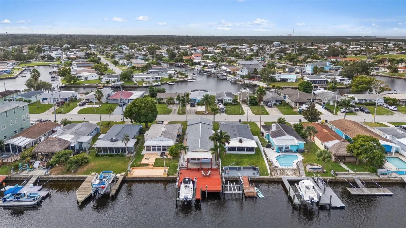 Aerial view of home with red deck/boat lift looking south.