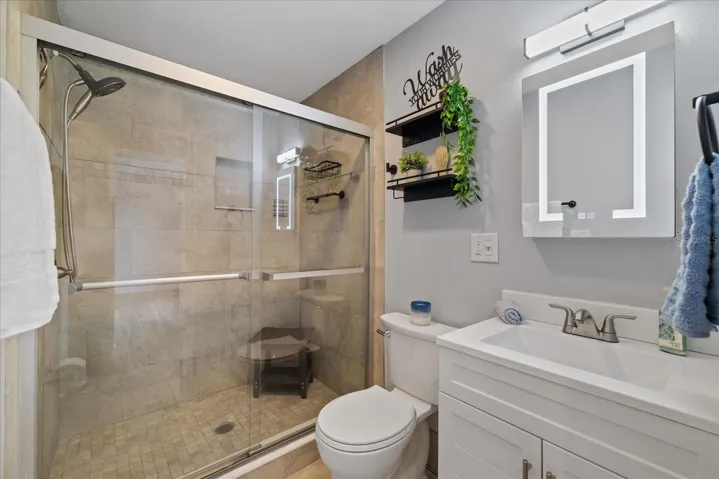 Updated bathroom 2 with walk in shower and LED mirror/vanity cabinet