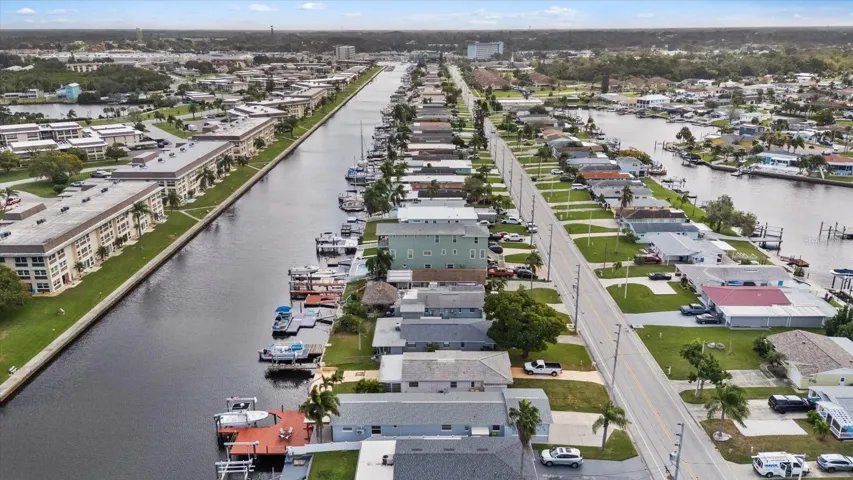 Aerial view of home with red deck and both lift up  North Channel looking east