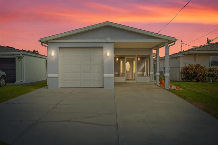 Virtually enhanced twilight front view of home.