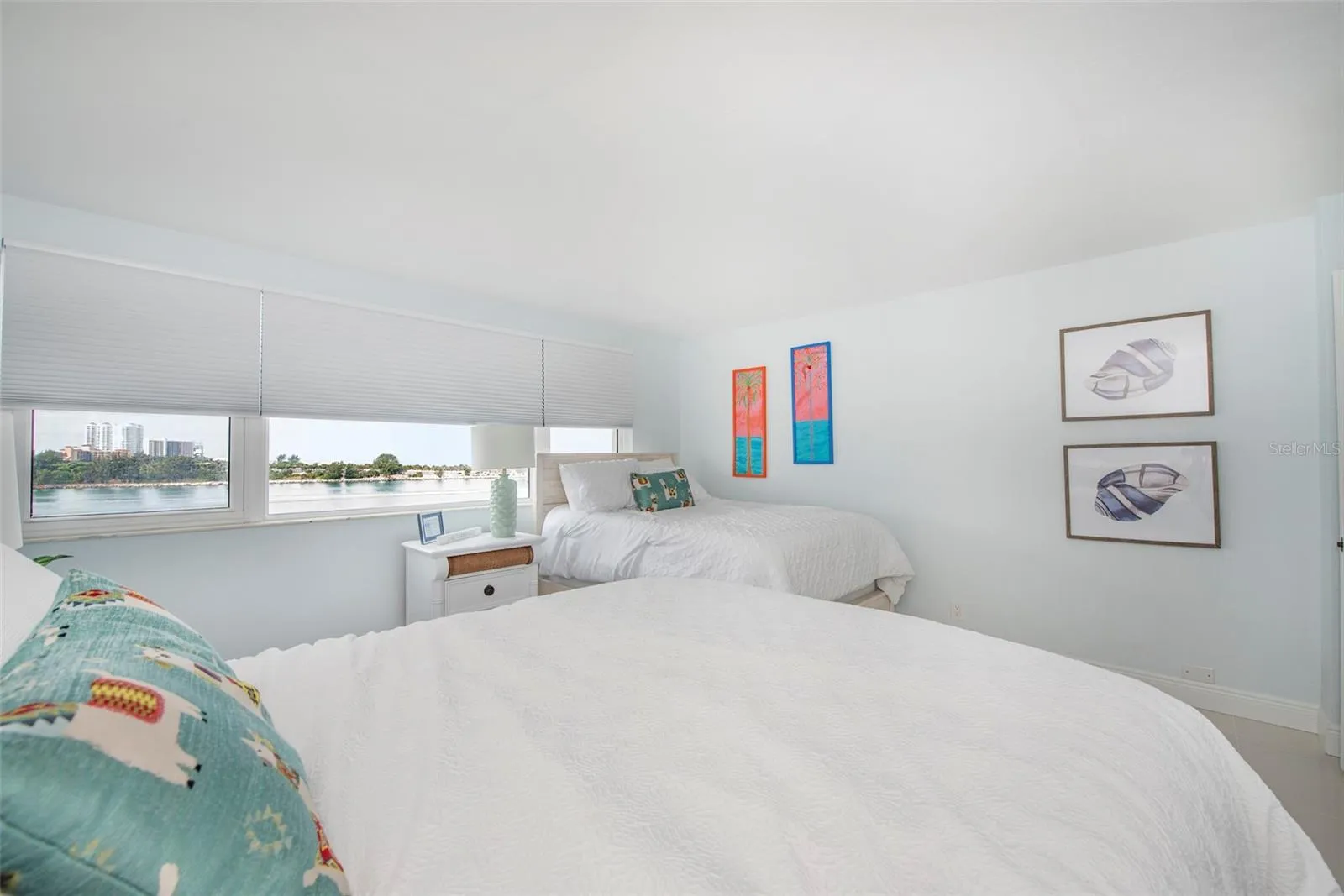 Bedroom II have two full beds and VIEWS along one whole side as well as large closet