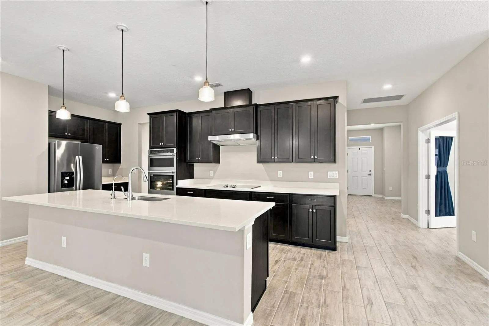 Kitchen with front door in the background