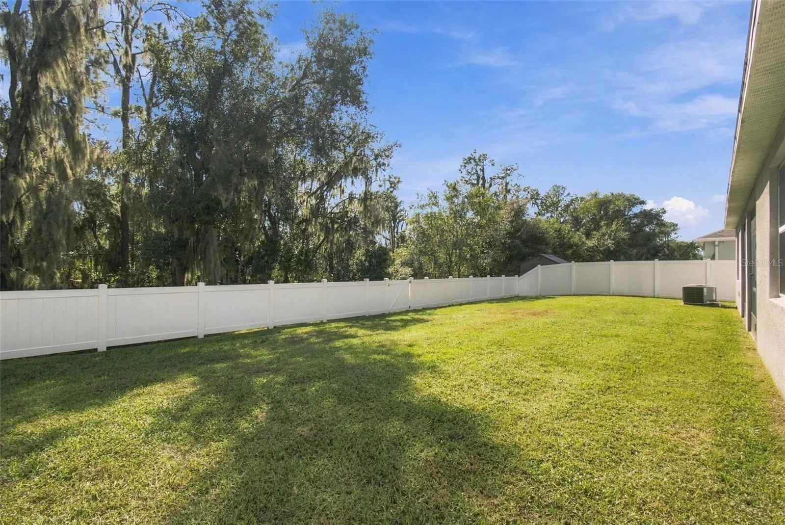 Huge backyard with conservation views and brand new white vinyl fence