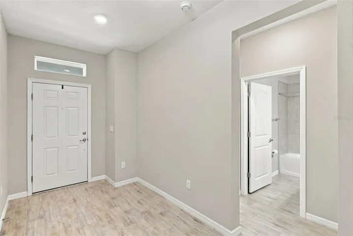 Front Door to the left, hall to enter Guest Suite on the right