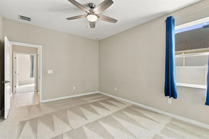 Larger bedroom with ceiling fan