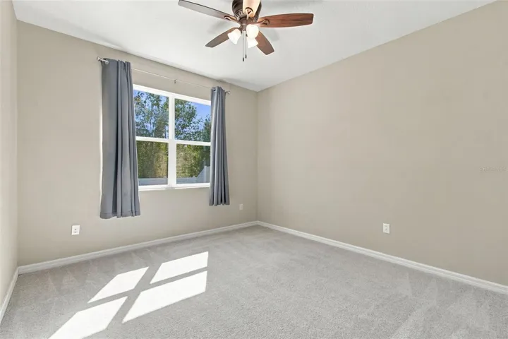 Bedroom facing backyard with conservation views