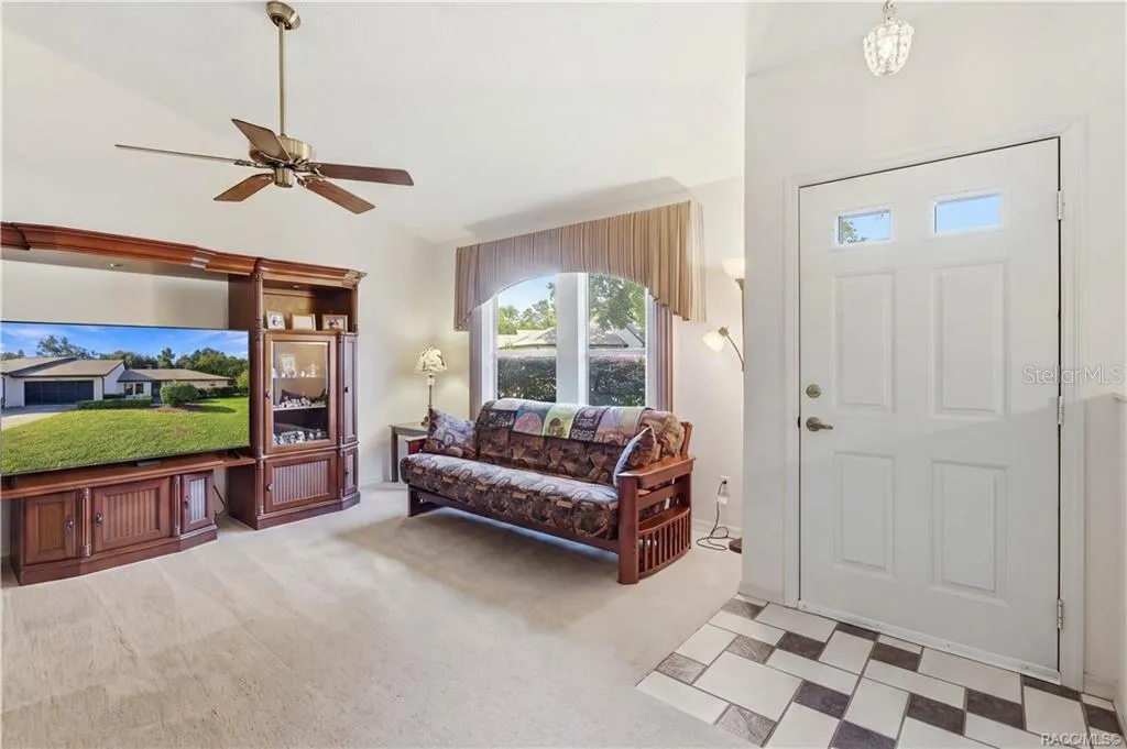 MAKE YOURSELF AT HOME! Bright &amp; inviting LIVING ROOM w/VAULTED CEILINGS, CEILING FAN &amp; large front window welcoming natural light!
