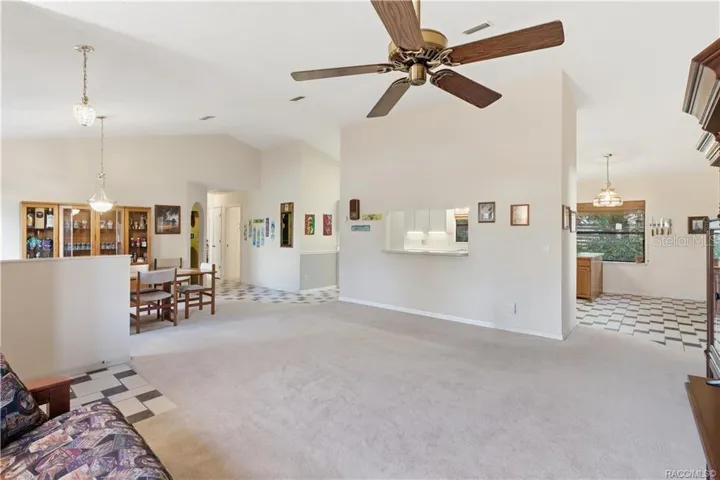 OPEN SPACES, ENDLESS POSSIBILITIES! Spacious LIVING ROOM features soaring VAULTED CEILINGS &amp; an OPEN FLOOR PLAN connecting the dining area &amp; kitchen!