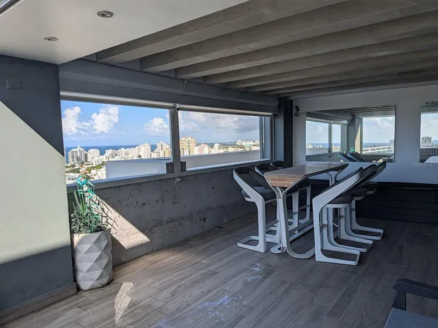 Covered terrace – bar seating with city and ocean views