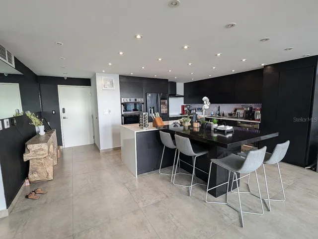 Kitchen – black cabinetry and large island
