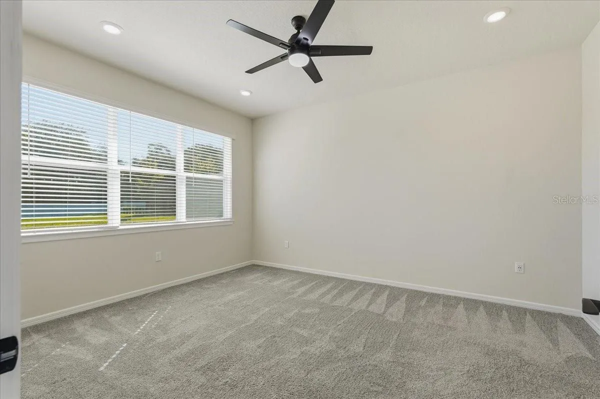 Primary Bedroom with Lighted Ceiling Fan and LED Downlights