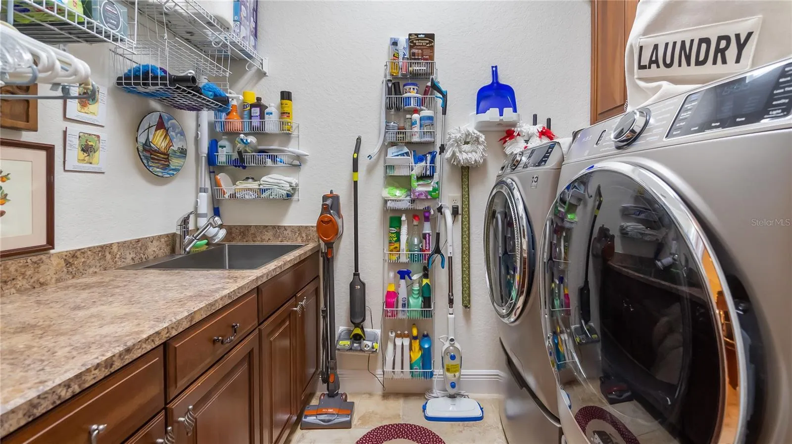 Laundry Room with Cabinetry and Sink