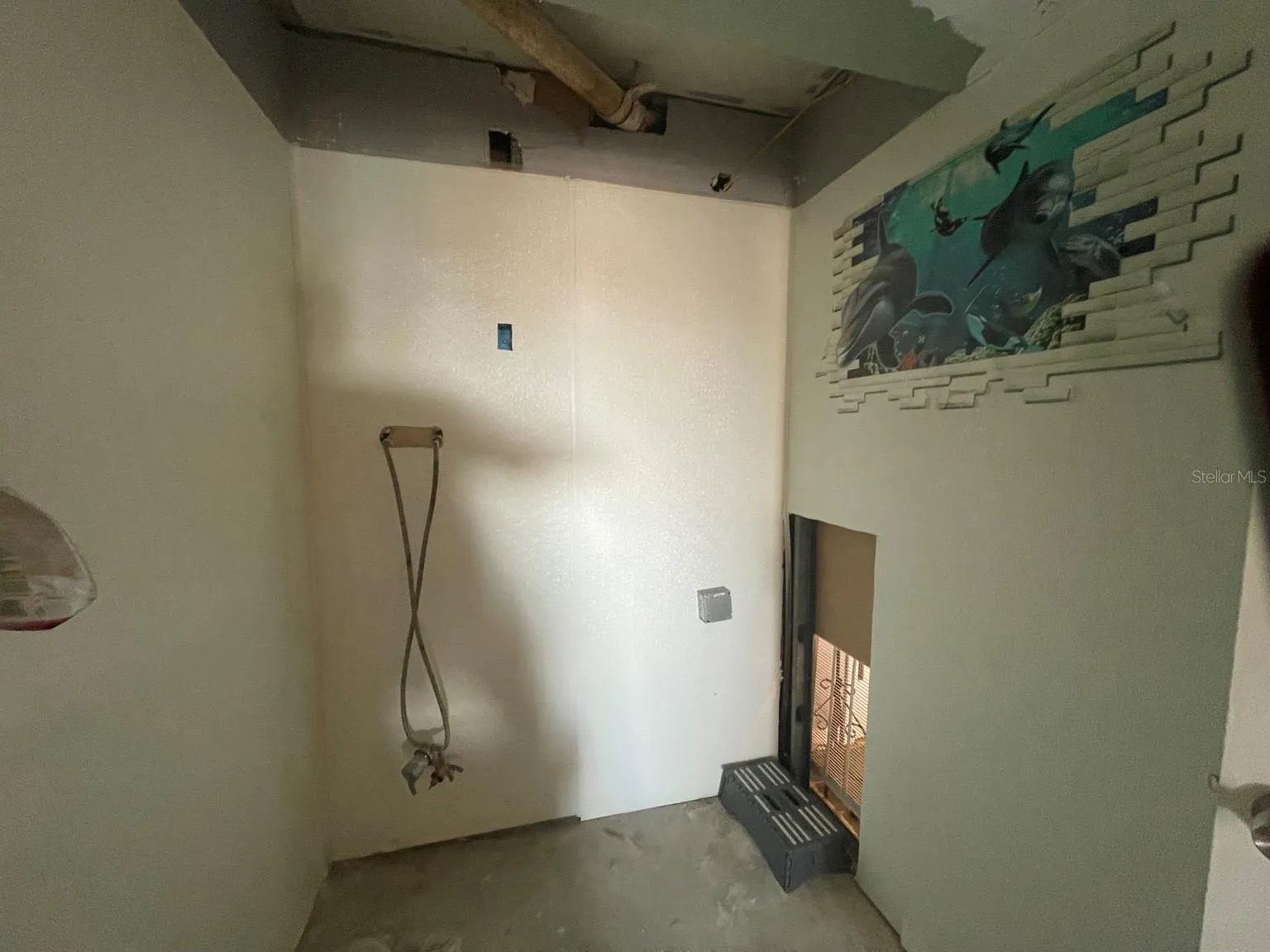 Unfinished bathroom shower area