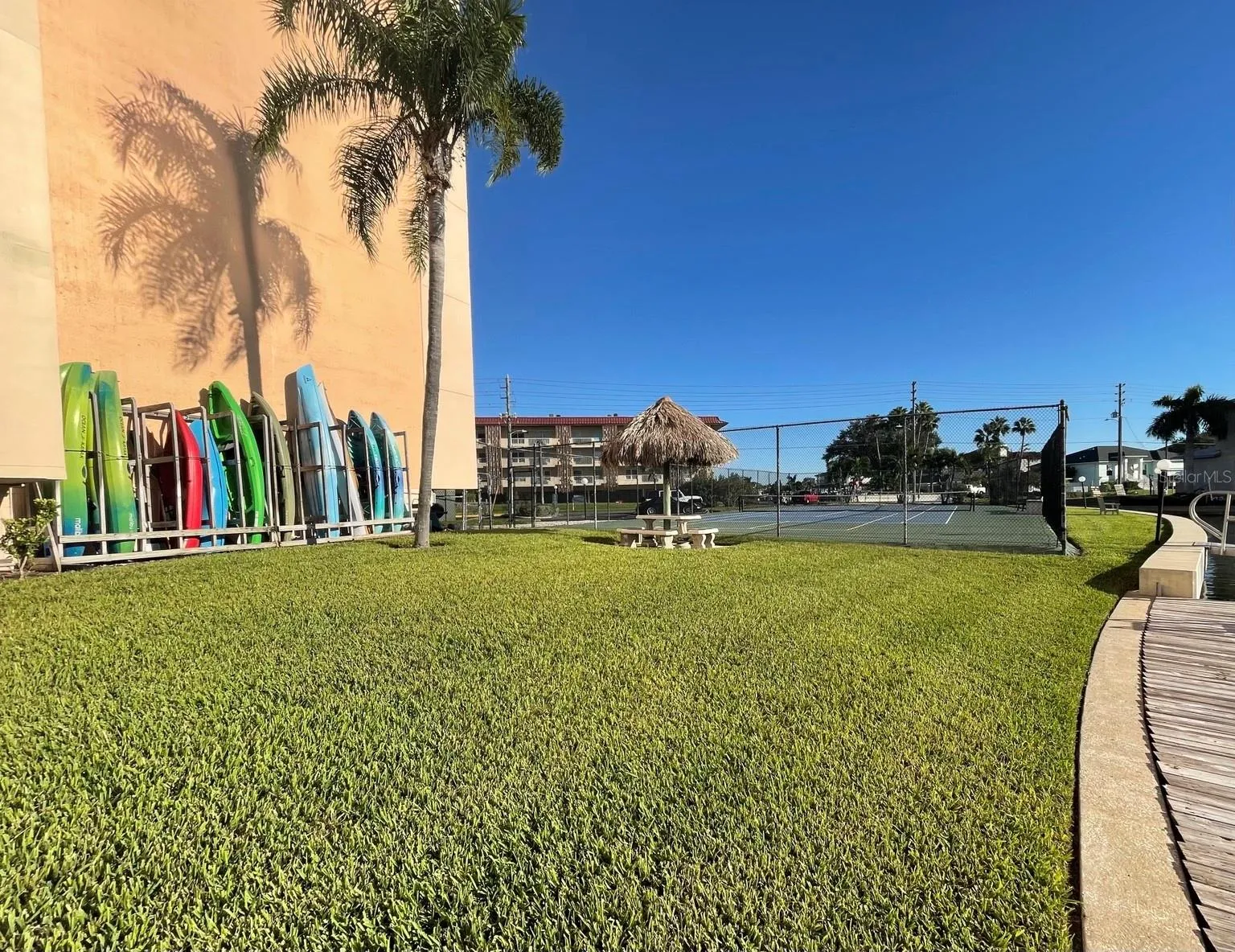 Paddle board and Kayak rack featuring grassy area &amp; Tennis court