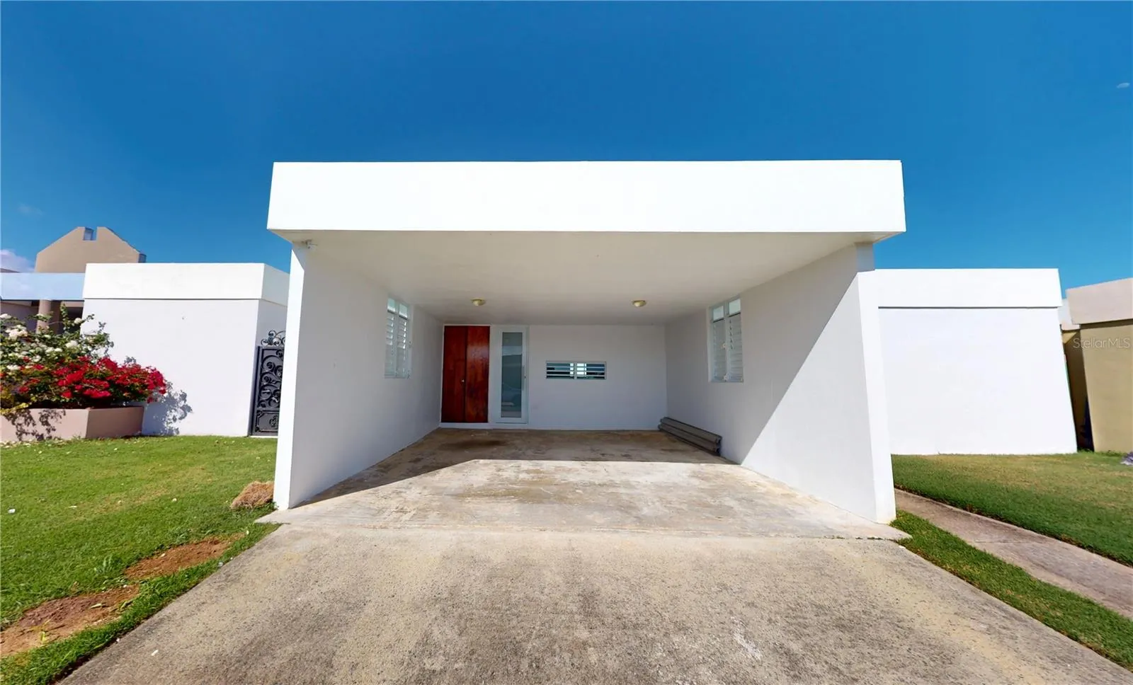 2 CAR CARPORT SIDE BY SIDE WITH CLOSET AND ACCESS TO THE KITCHEN