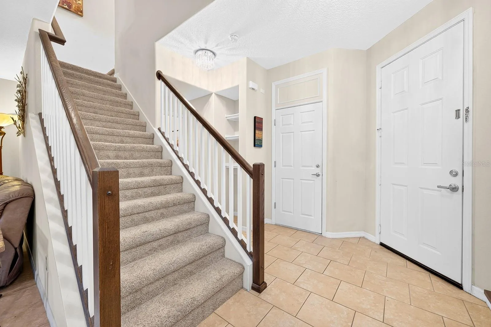 Major updates include a NEW ROOF (2025), FRESH EXTERIOR PAINT (2025), LUXURY EXTRA-HIGH-PILE CARPET installed in 2020, and an AIR HANDLER REPLACEMENT in 2021.