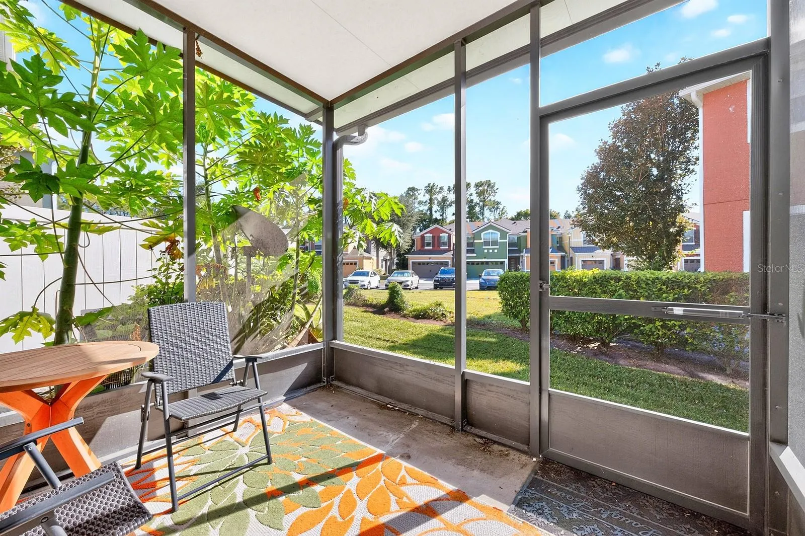 The screened rear porch is a lovely spot to enjoy your morning coffee or unwind at the end of the day.