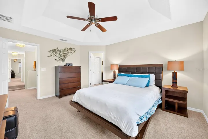 Upstairs, the spacious Primary Bedroom offers a TRAY CEILING, plush carpet and a private EN SUITE BATH.