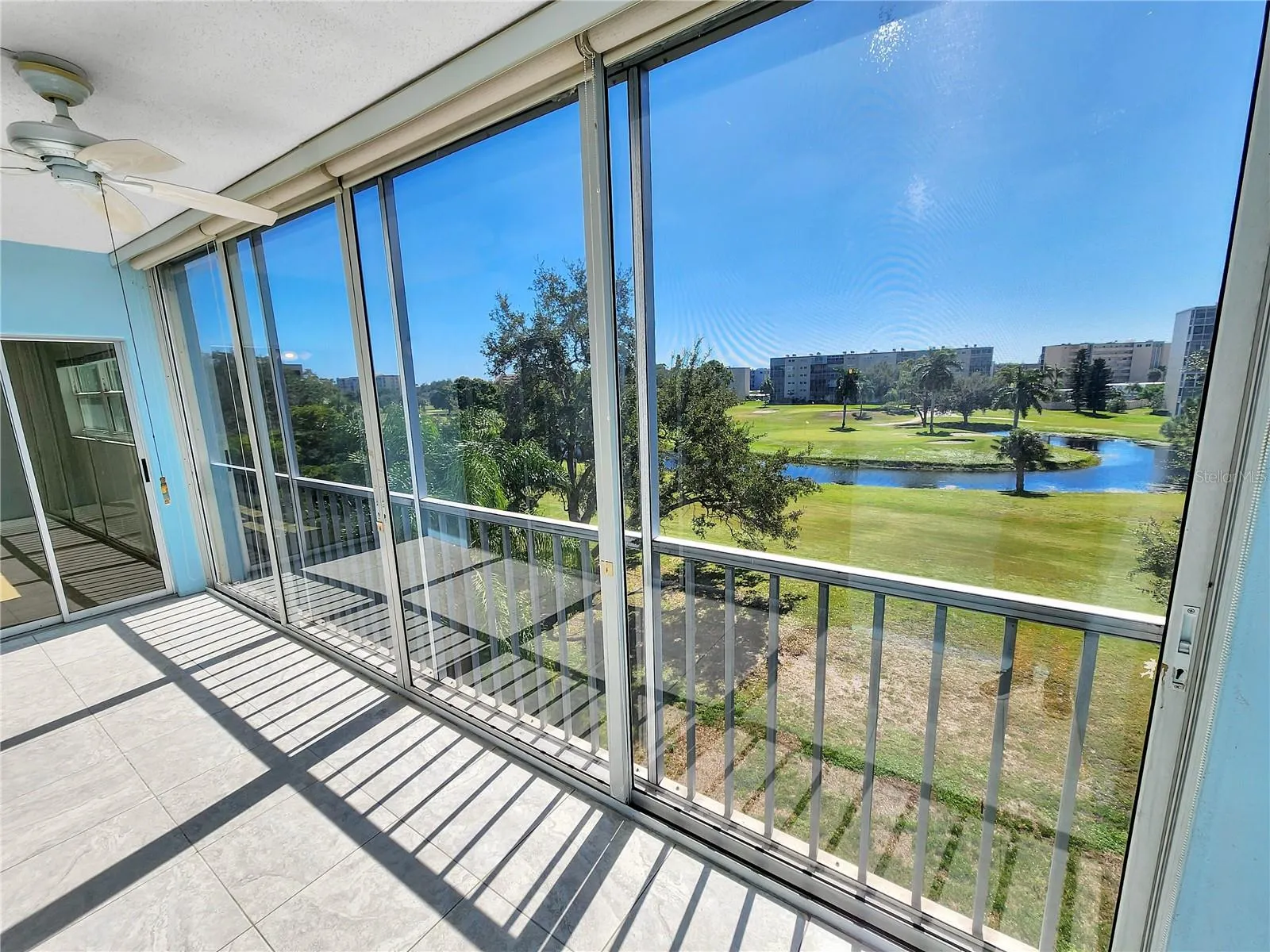 Balcony with golf course view. Door to primary bedroom