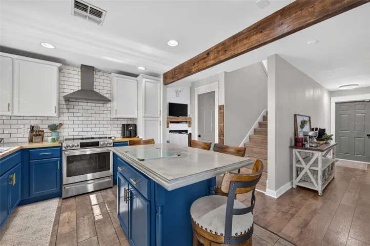 Kitchen with view of the staircase and door to garage