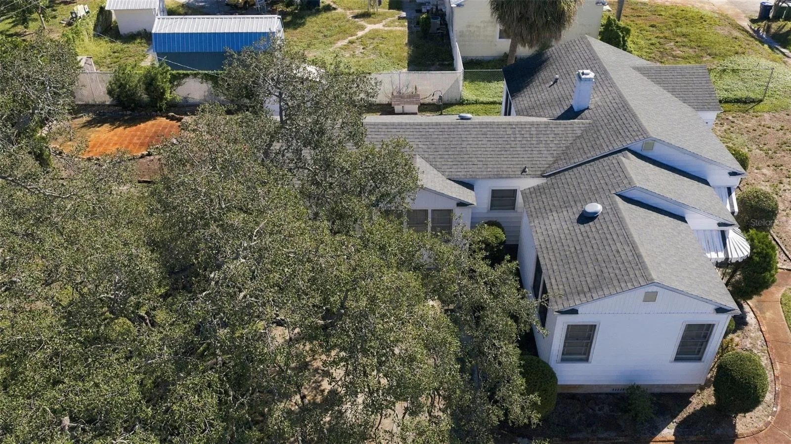 Overhead West side of house and driveway looking east