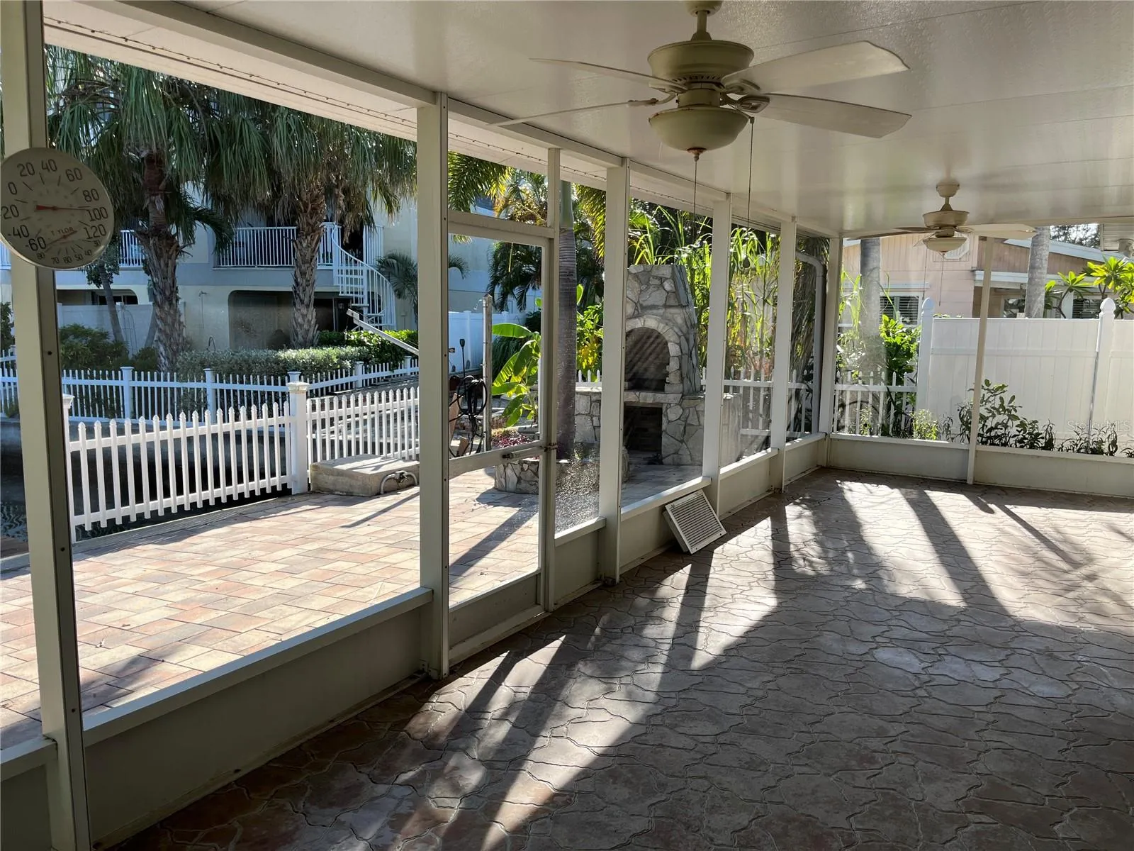 Outdoor covered patio with ceiling fan