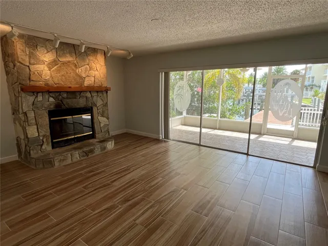 Living room with covered patio access and view of the canal