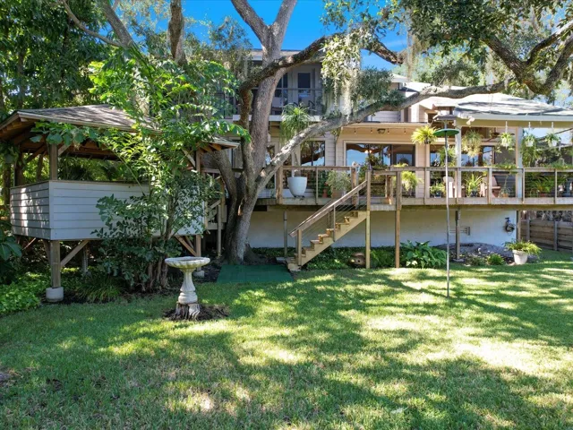 Access to the porch and Gazebo to the left nestled among the trees