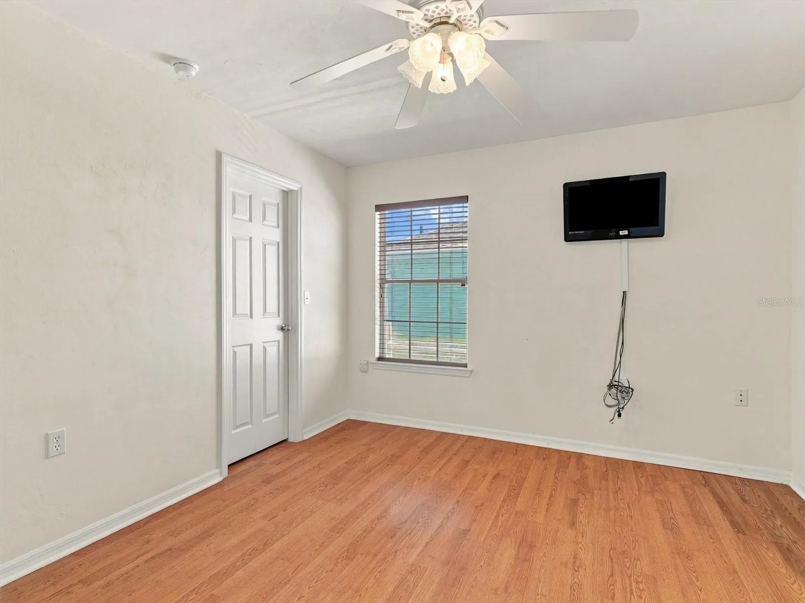 Bedroom 2 - Walk in Closet with mounted TV
