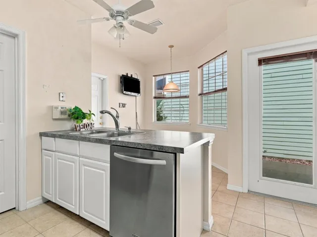 Kitchen looking over Dinette plus Door to Patio and Courtyard.