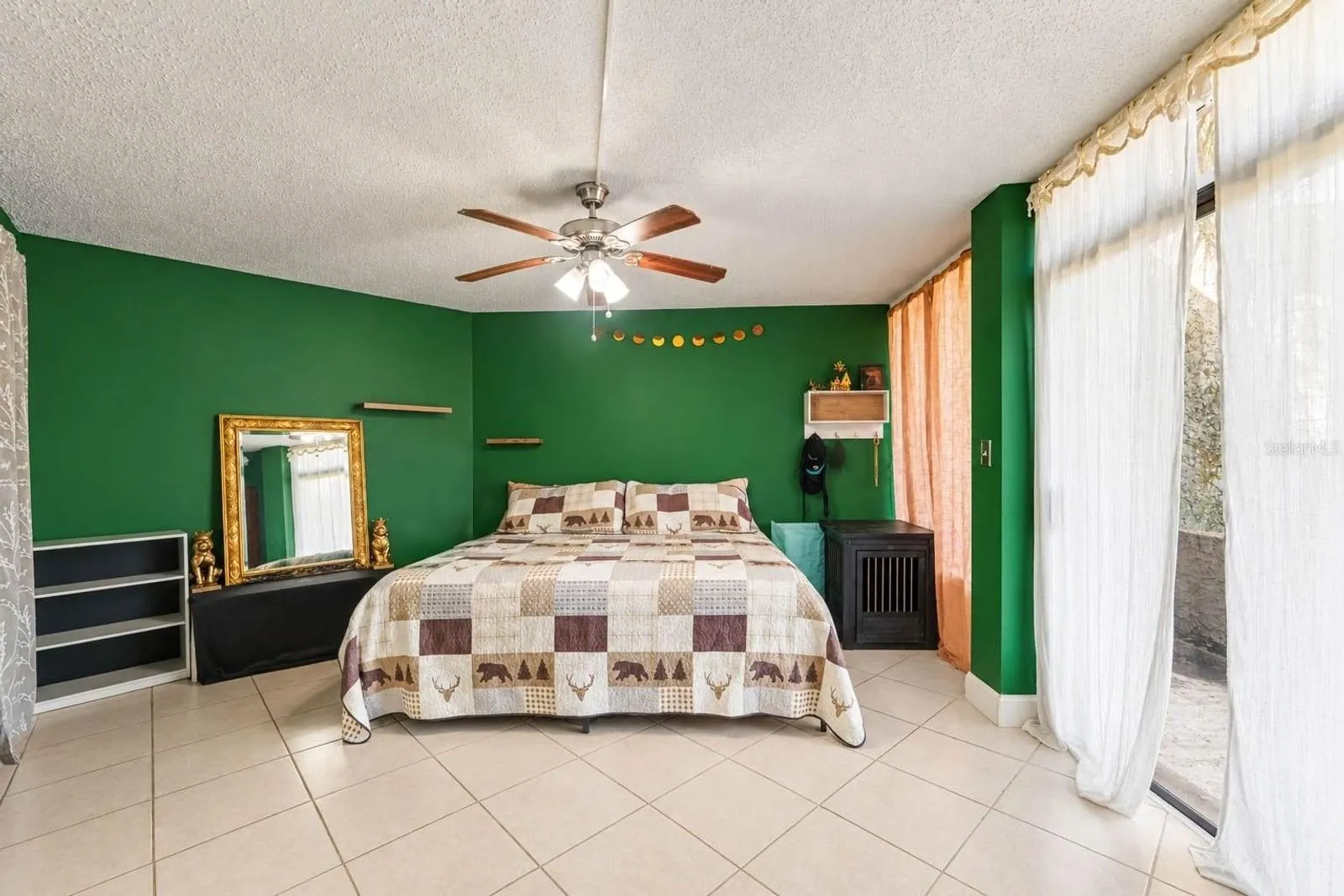 Master Suite with Green Accent Walls, Gold-Framed Mirror &amp; Abundant Natural Light