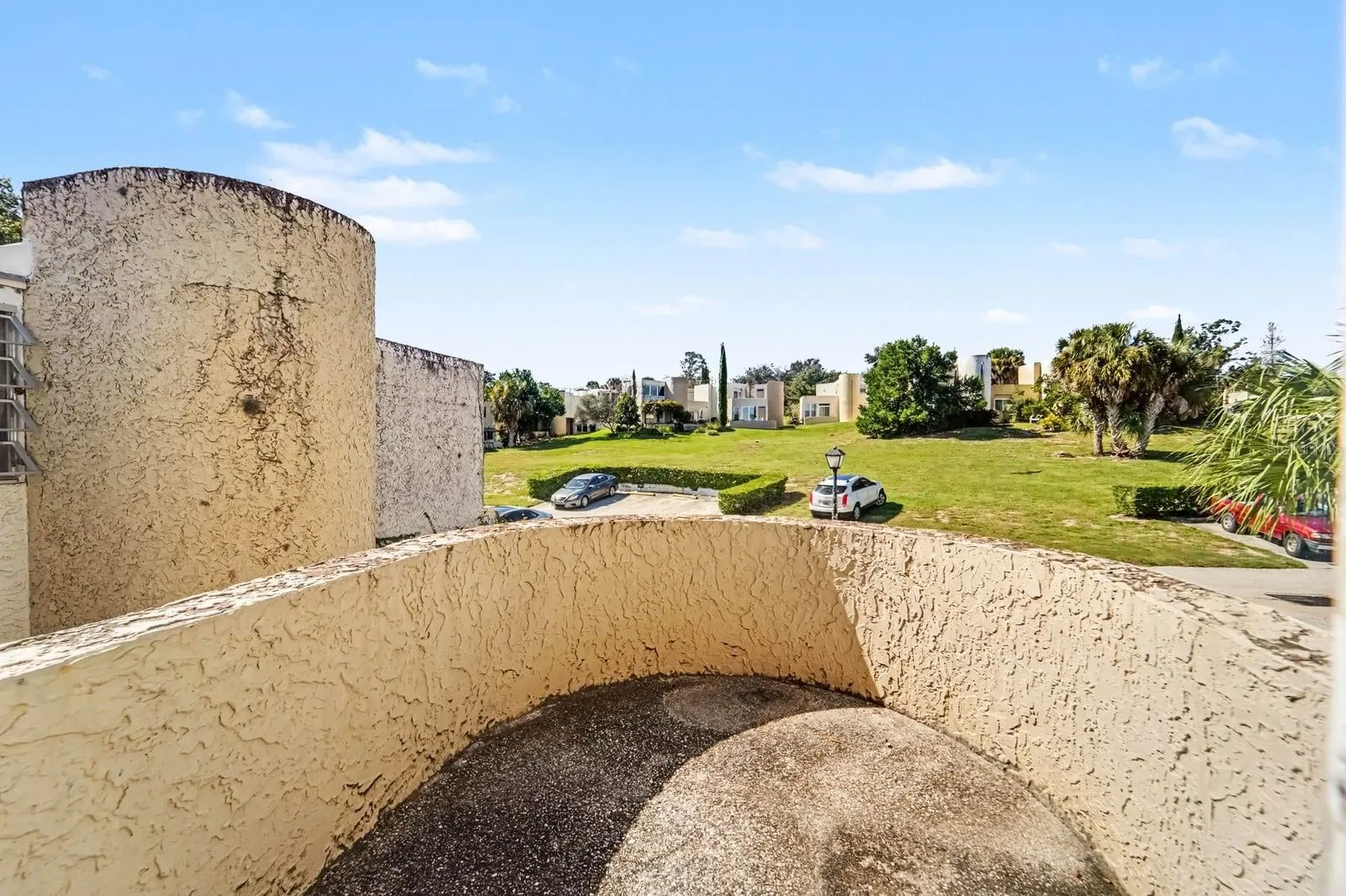 Unique Cylindrical Courtyard Design with Community Grounds &amp; Parking