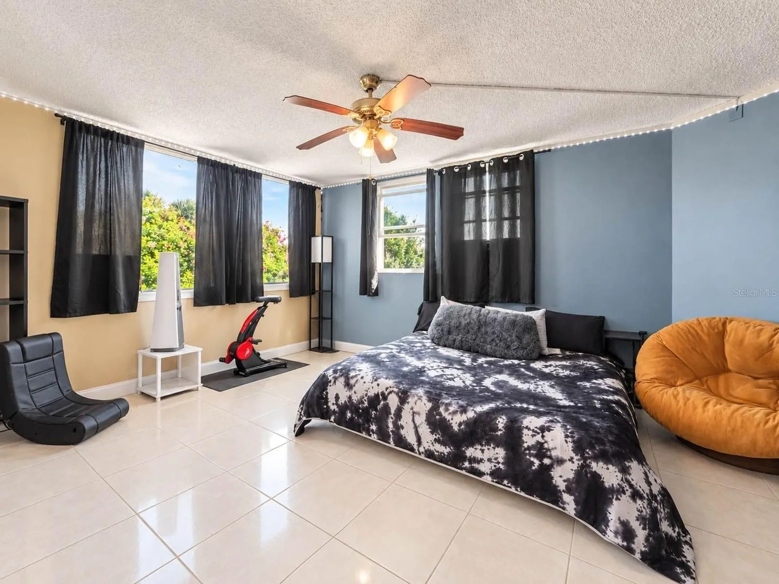 Bright Master Suite with Multi-Tone Walls, Ceiling Fan &amp; Ample Windows