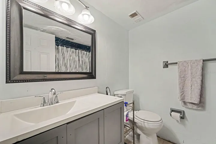 Full Bathroom with Dual Sink Vanity, Framed Mirror &amp; Updated Fixtures