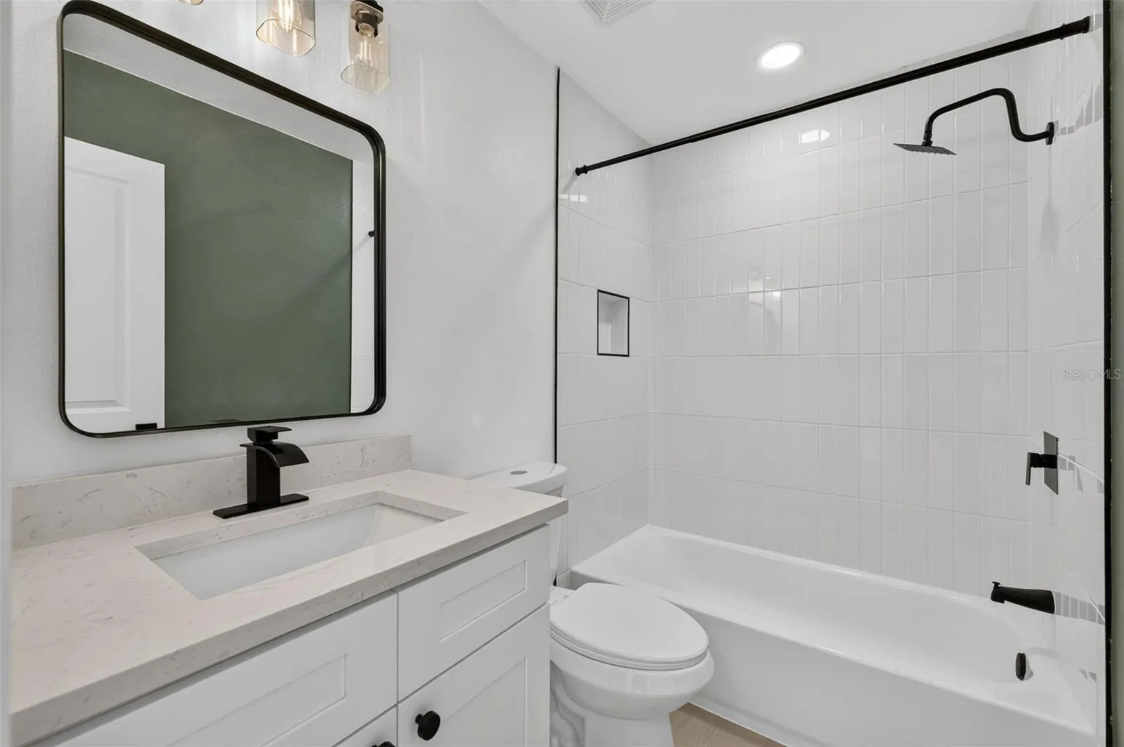 Conveniently located guest bathroom with a clean, functional layout.