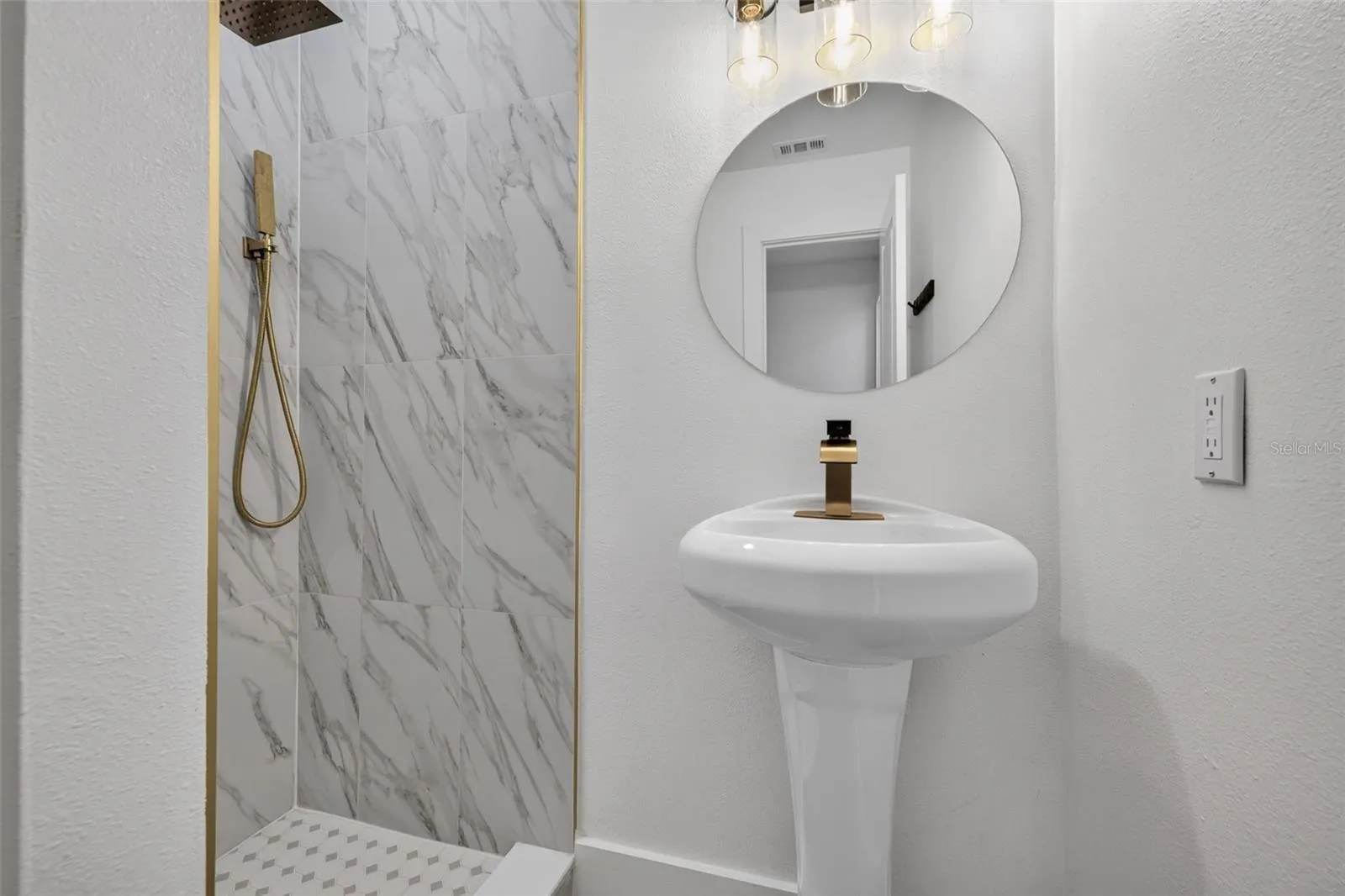 Thoughtful updates and contemporary details bring a fresh, modern feel to this private ensuite bathroom.