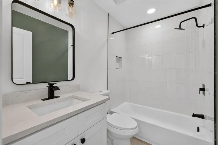 Conveniently located guest bathroom with a clean, functional layout.