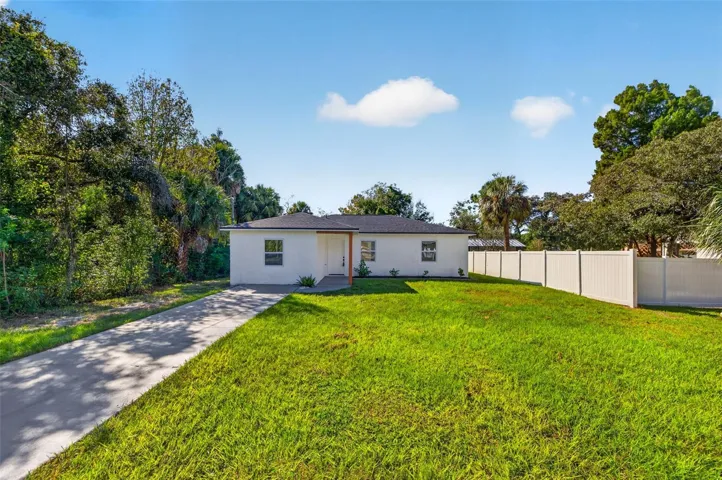 Extended driveway offers parking for up to four vehicles.