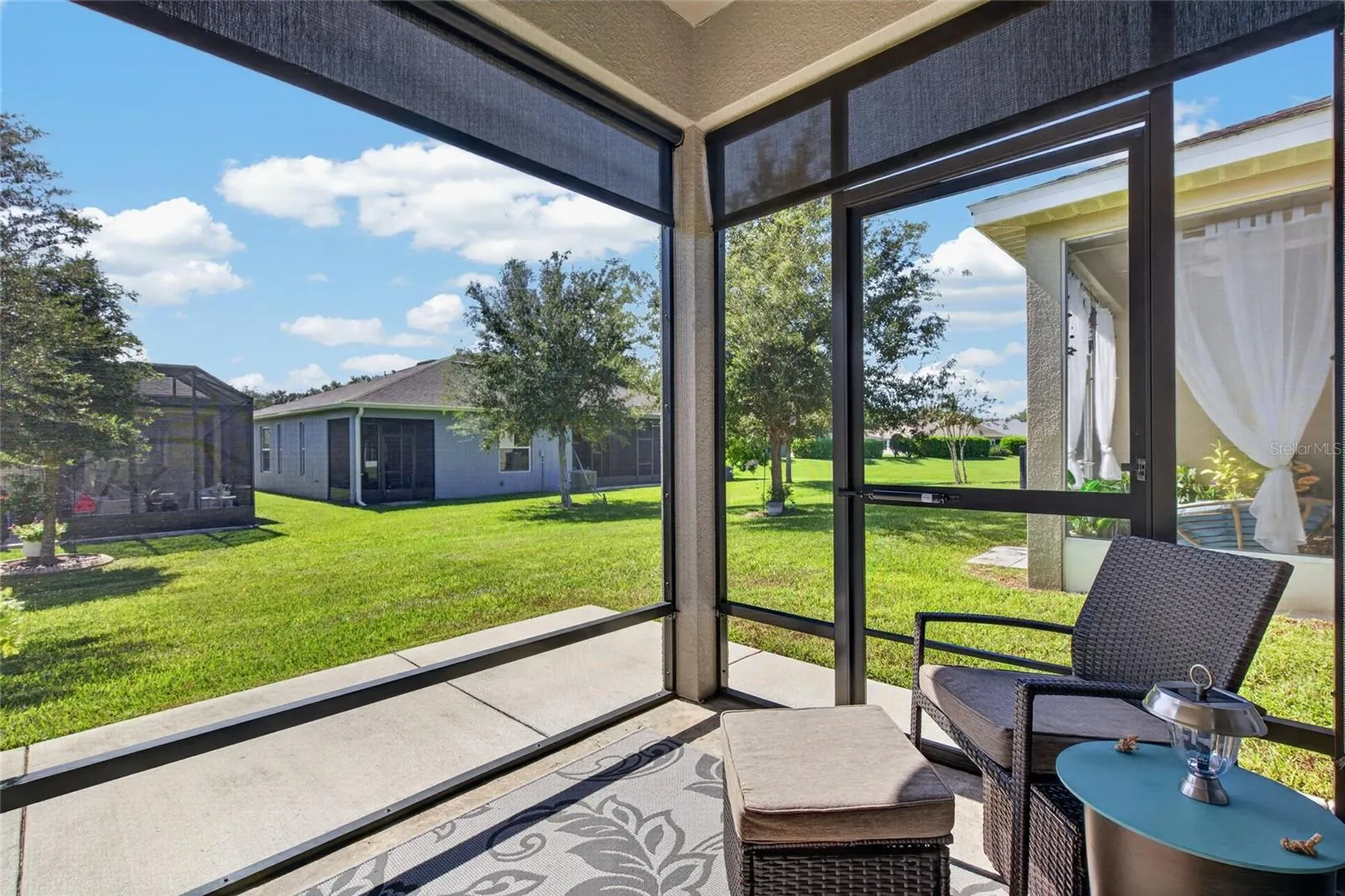 Screen lanai with roller sun shades