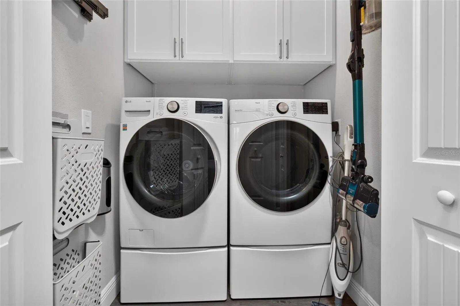 Laundry room with custom built in storage