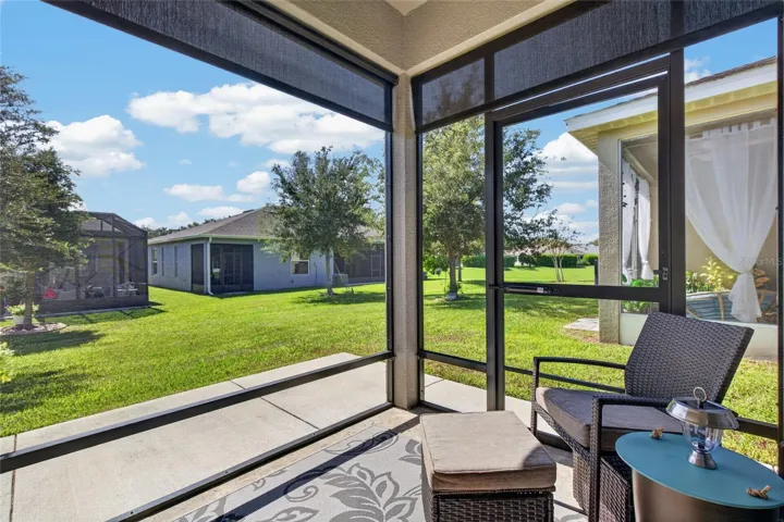 Screen lanai with roller sun shades